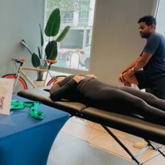 Physical therapist Dr. Philip do Nascimento, DPT providing an injury screening.